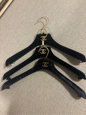CHANEL Black and Gold Velvet Hangers with Signature CC Emblems